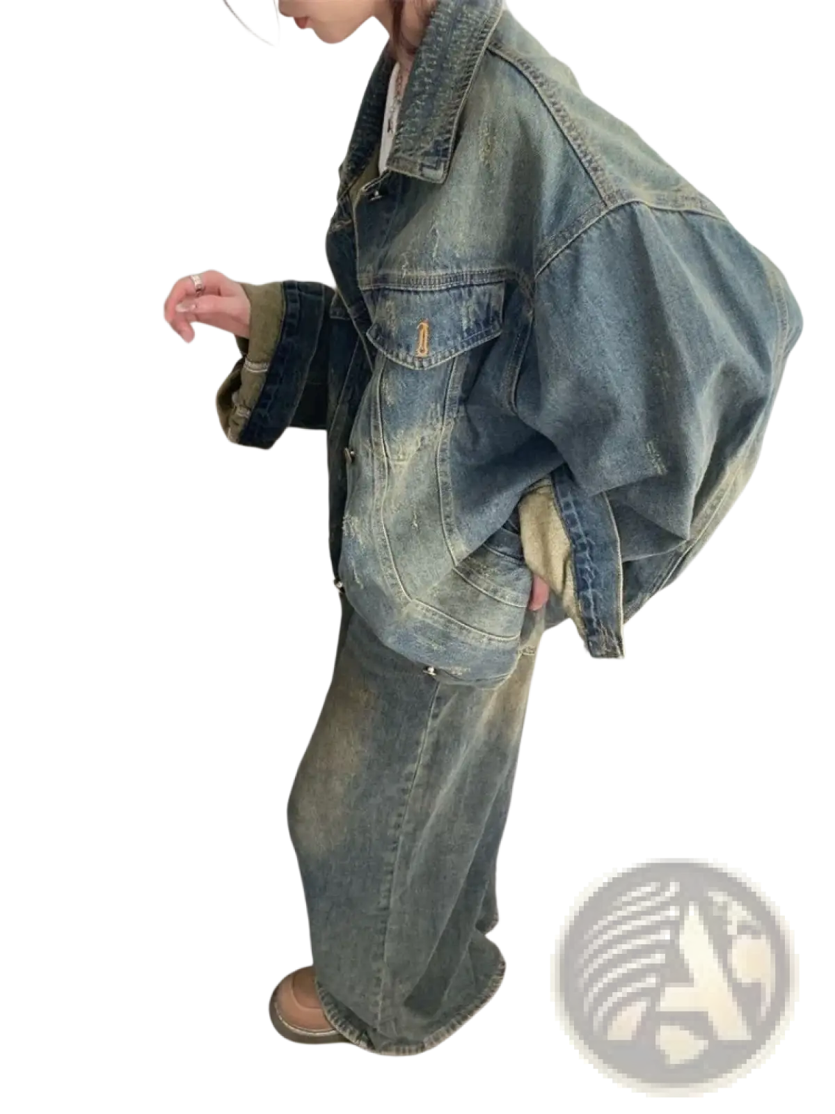 A faded blue distressed vintage denim jacket with a relaxed oversized fit and visible stitching details