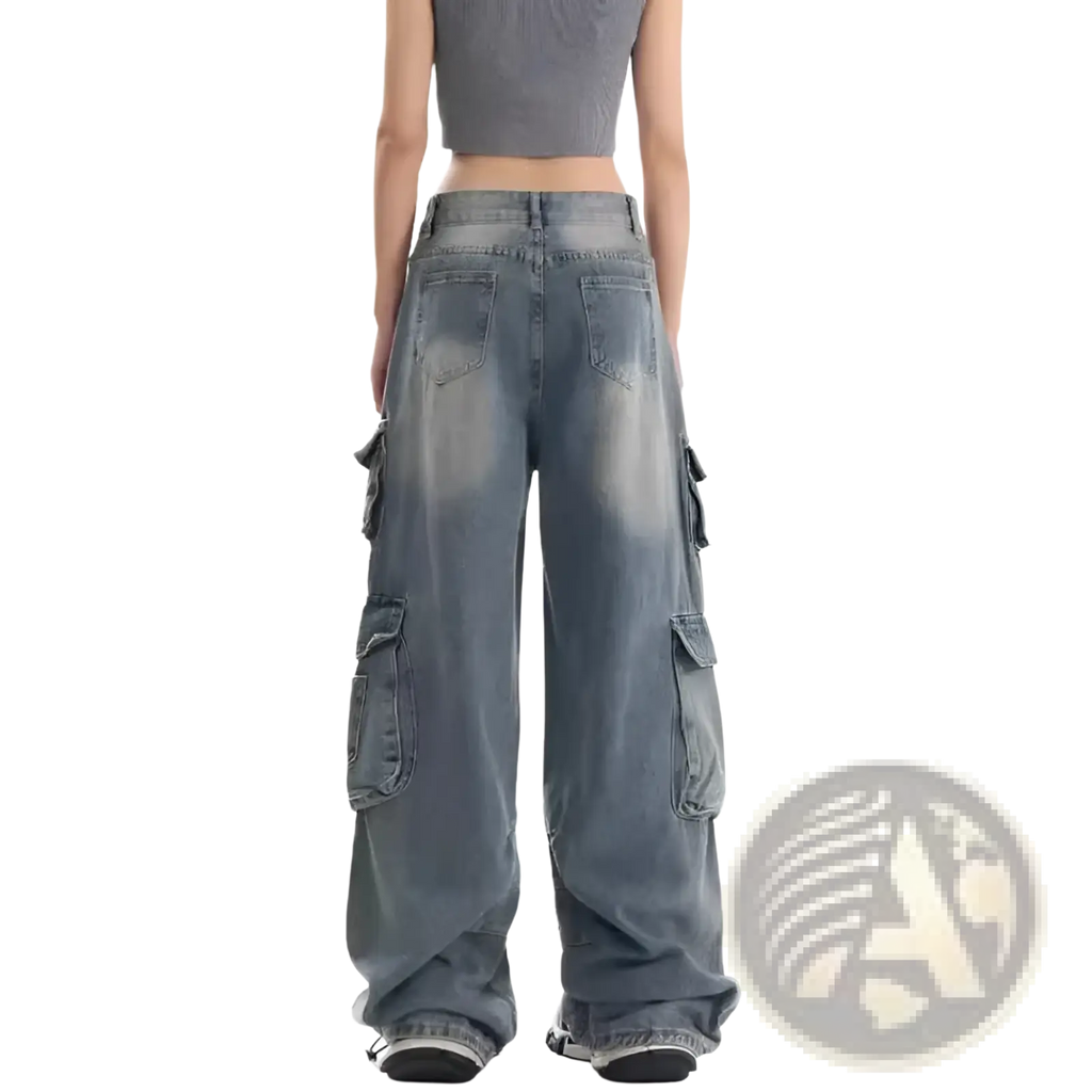 Distressed wide leg denim cargo pants in faded blue wash with multiple pockets and a relaxed oversized fit