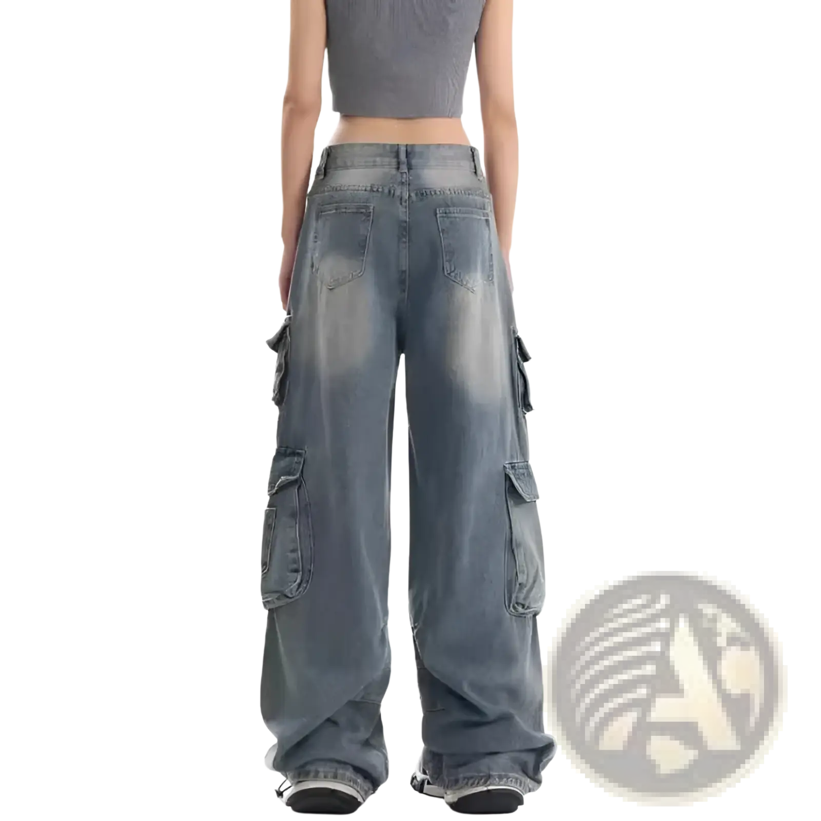Distressed wide leg denim cargo pants in faded blue wash with multiple pockets and a relaxed oversized fit