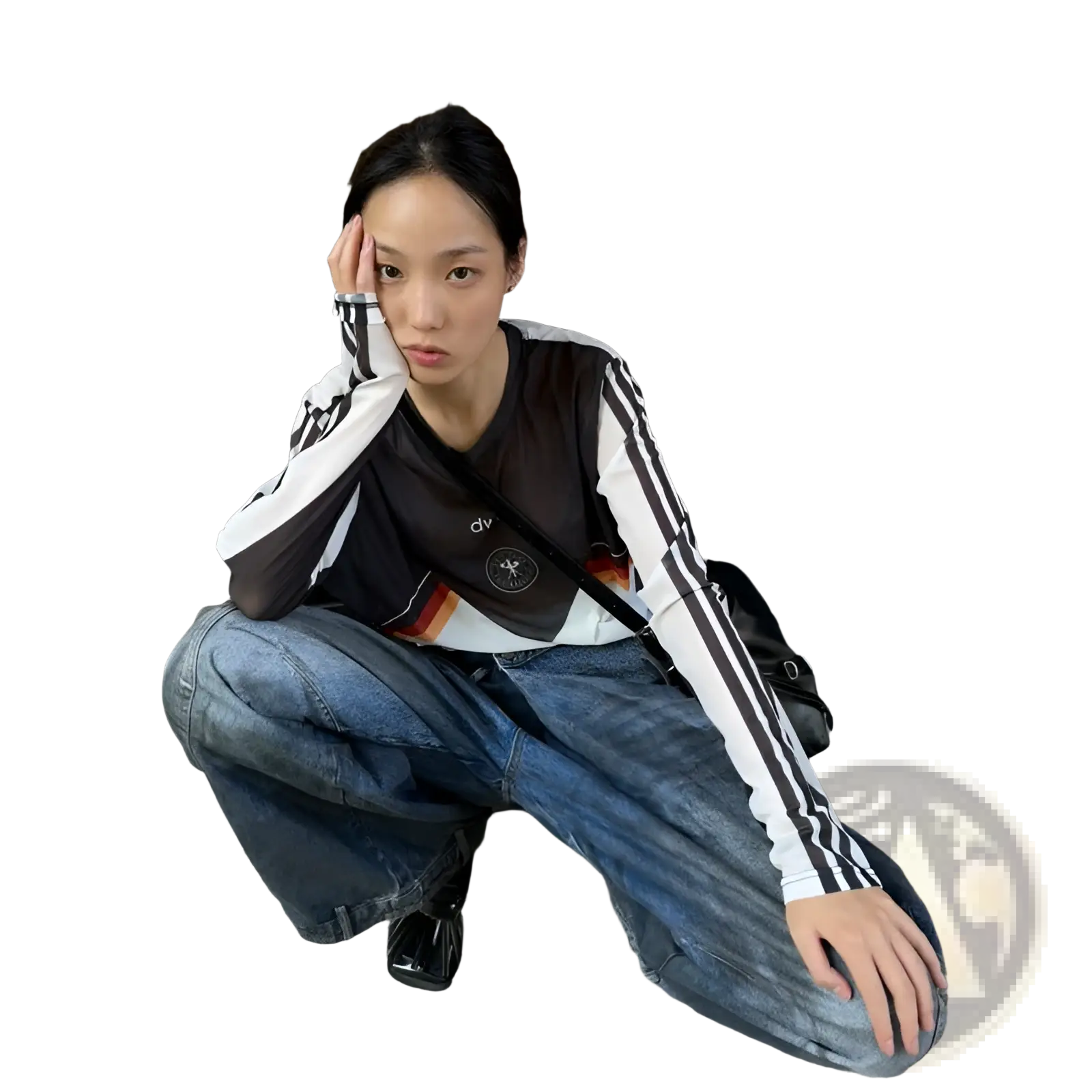 Black and white long-sleeved athletic top with three stripes and logo paired with distressed wide leg vintage denim jeans