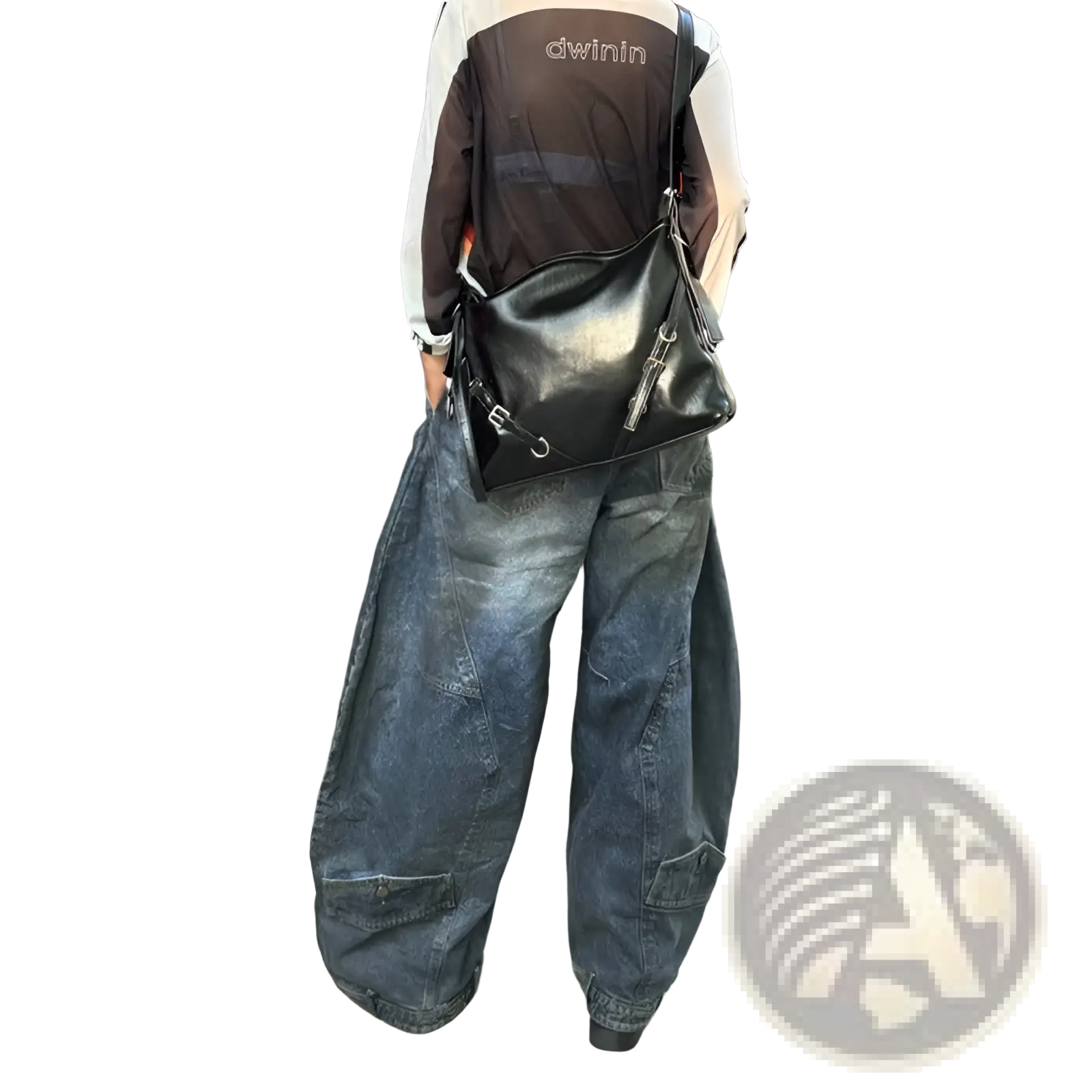 Black leather crossbody bag with silver hardware and front zipper detail paired with distressed wide leg vintage denim pants