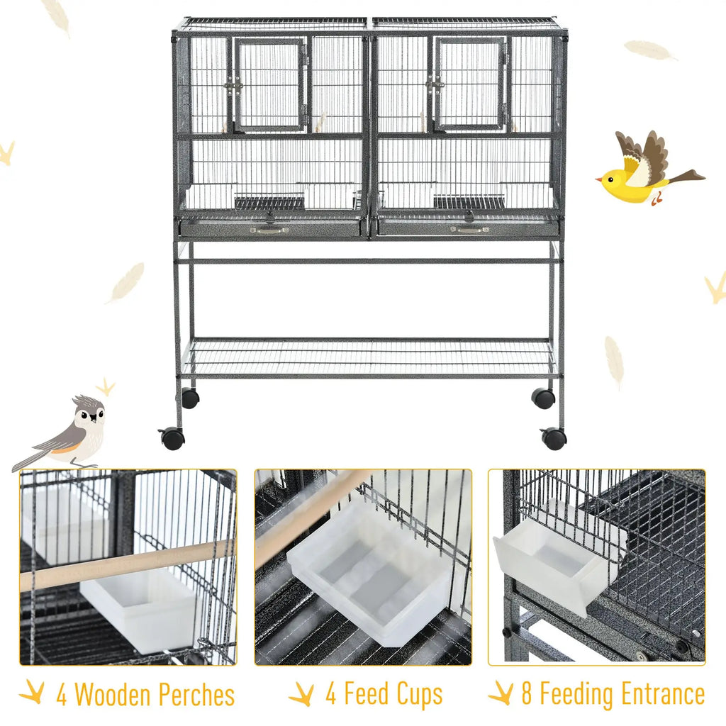Divided breeder bird cage in black metal with two compartments each having a door and a tray below with rolling stand