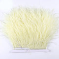 A bundle of pale yellow premium ostrich feather fringe trim neatly tied for diy fashion projects
