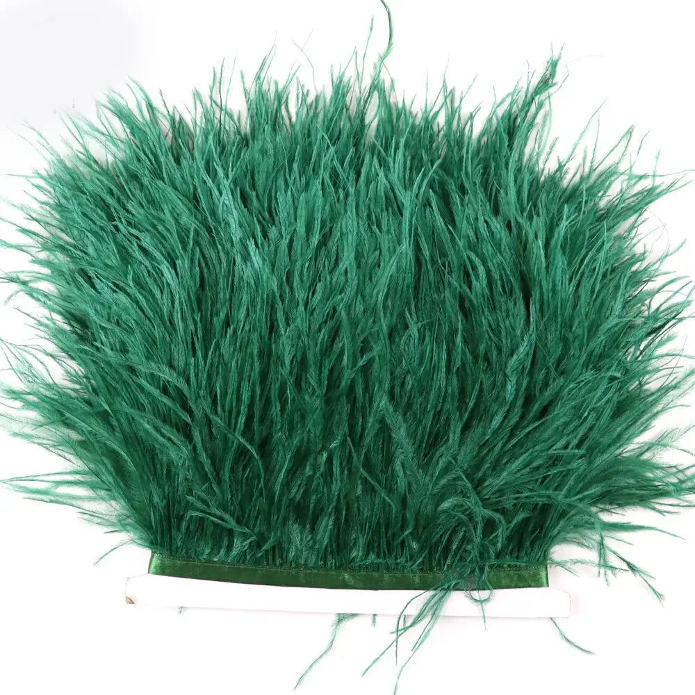 Premium feather fringe and ostrich trim featuring lush vibrant green dense fluffy feathers for diy fashion projects