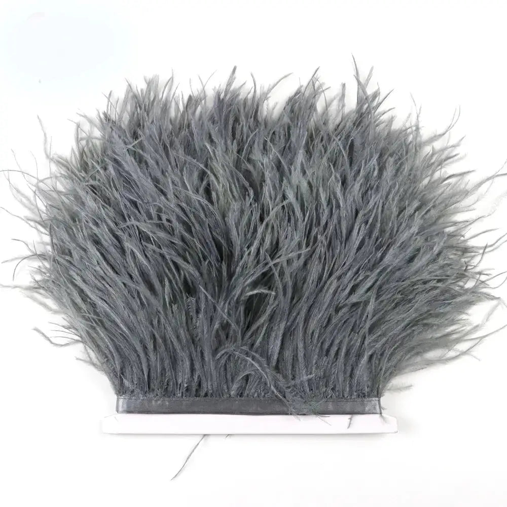 Premium feather fringe and ostrich trim showing dense gray feathers with soft texture and black adhesive backing