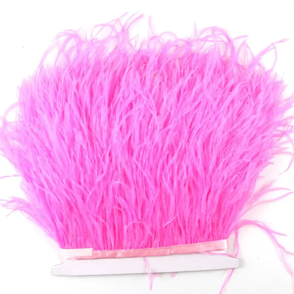 Bright pink premium feather fringe and ostrich trim with soft fluffy delicate feathery texture for diy fashion