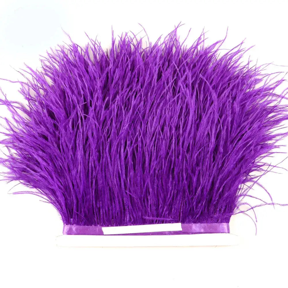 Premium feather fringe and ostrich trim in vibrant purple with soft texture and neatly bound base for diy fashion projects