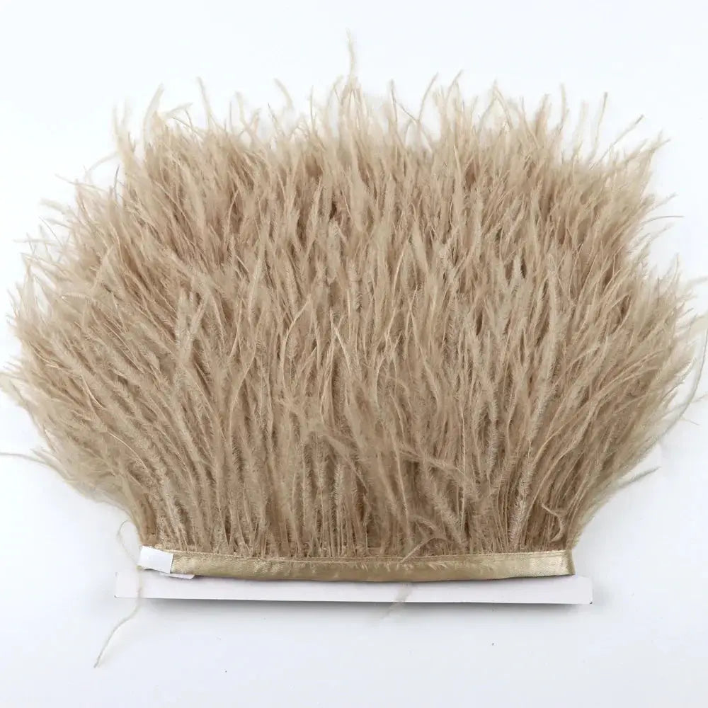 Beige premium feather fringe with soft fluffy texture and neatly bound edge for DIY fashion projects
