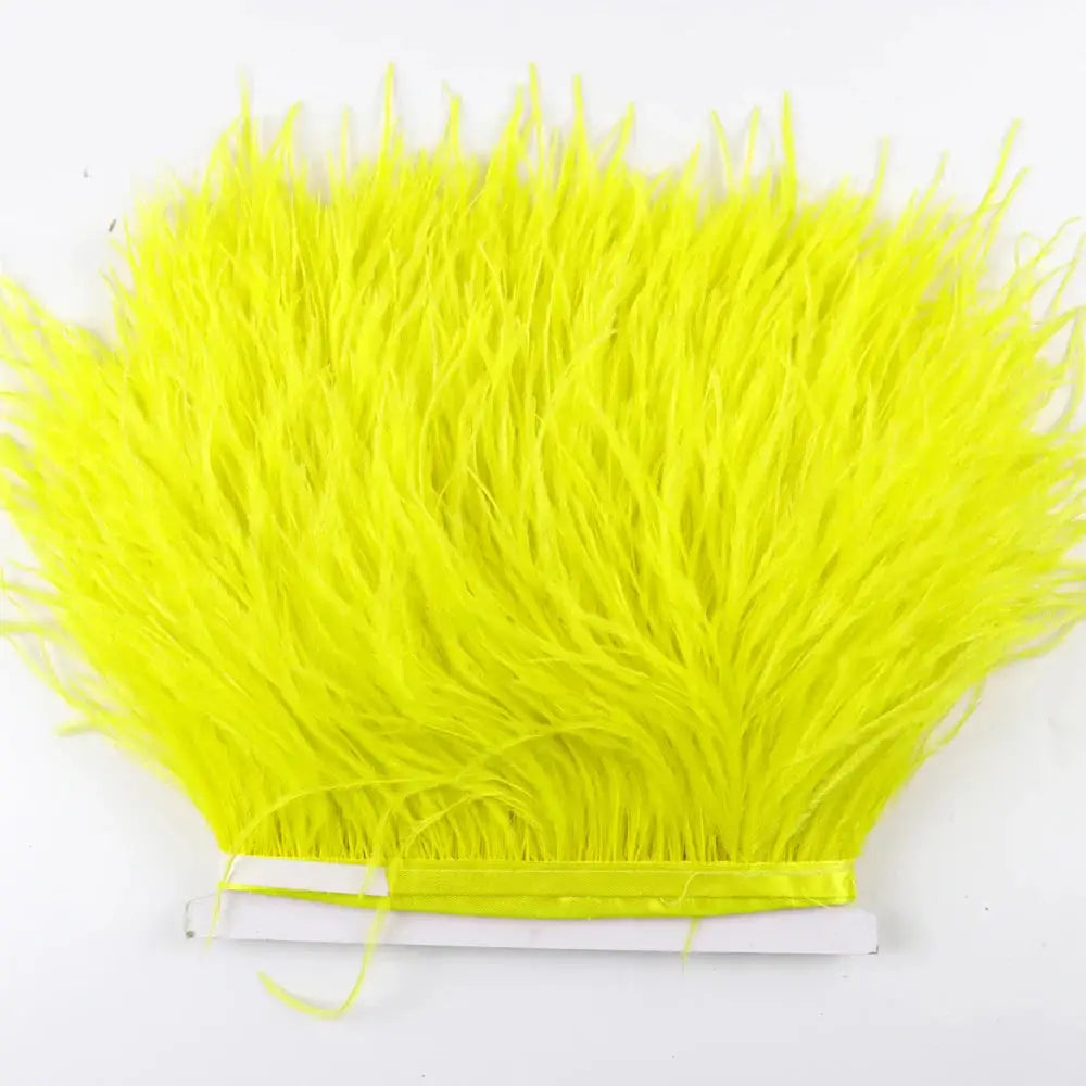 Bright neon yellow premium feather fringe and ostrich trim with silky fluffy texture and neatly bound edges for diy fashion