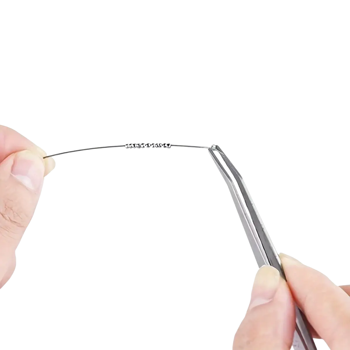 Delicate silver wire with small evenly spaced metallic beads featured in diy jewelry making tool set 8-piece kit