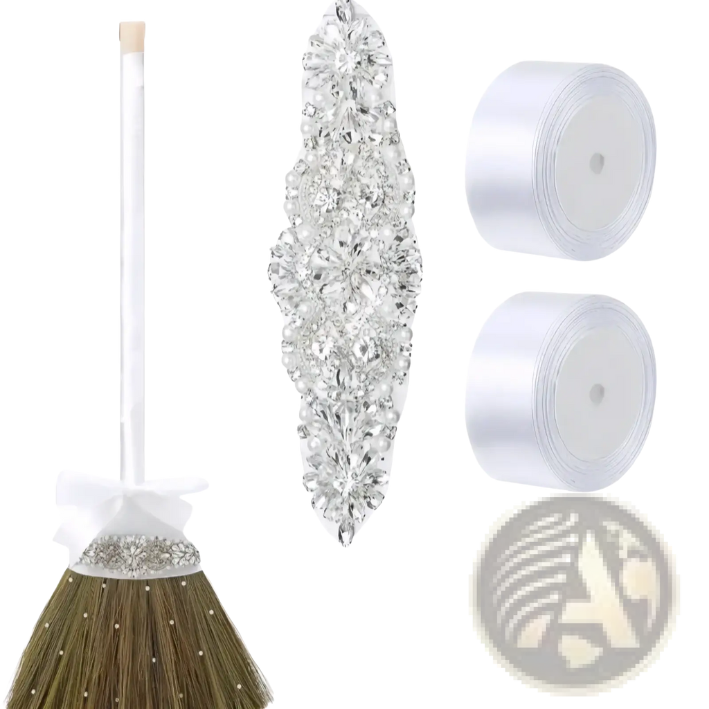 Diy wedding jumping broom with a sparkling silver rhinestone and pearl-embellished head and a white satin bow