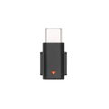 Black dji mic mini type c phone adapter with orange triangular indicator for mobile devices is shown from the back side