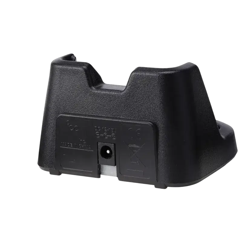 Black plastic dock charger for Icom bp-265 li-ion battery with central circular port and molded grip areas