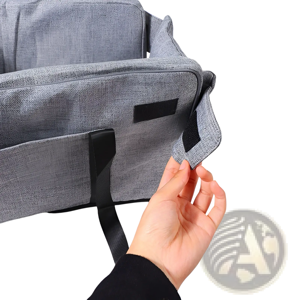 Gray textured fabric dog car seat and pet carrier kennel with black webbing straps and velcro patch
