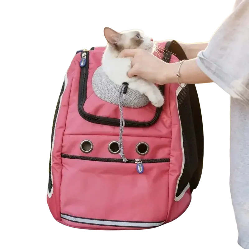 Pink dog carrier bag with black trim and silver vents featuring a gray mesh cat bed inside for small dogs travel