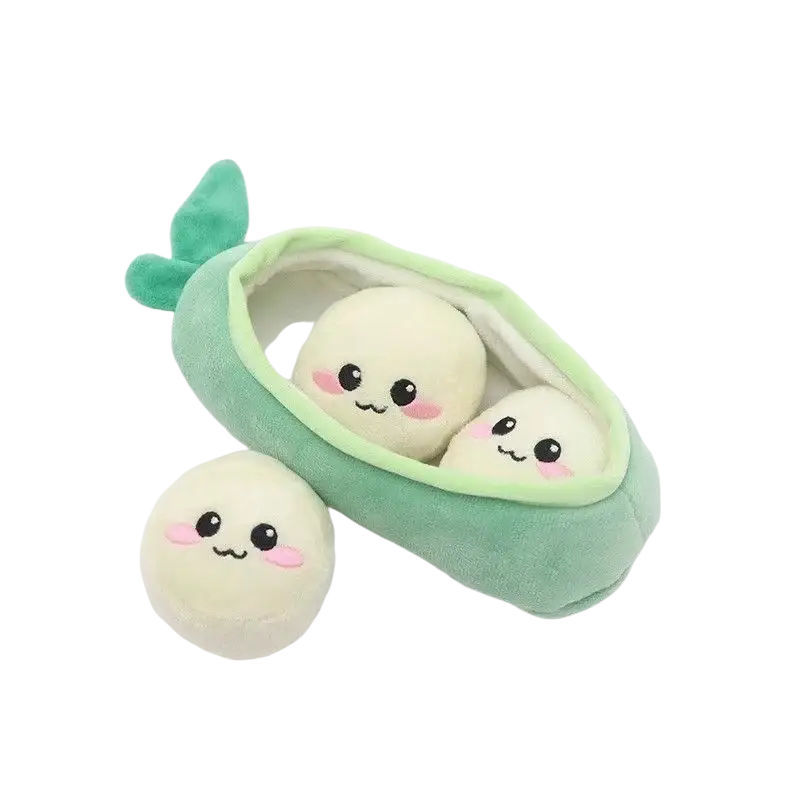 Soft mint-green plush pea pod dog chew toy with three cream smiling characters and one extra character beside it
