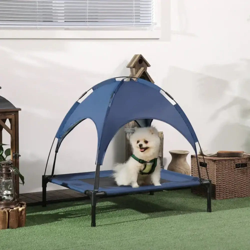 Blue mesh elevated cooling pet bed with removable canopy and black metal frame showing arched entrance
