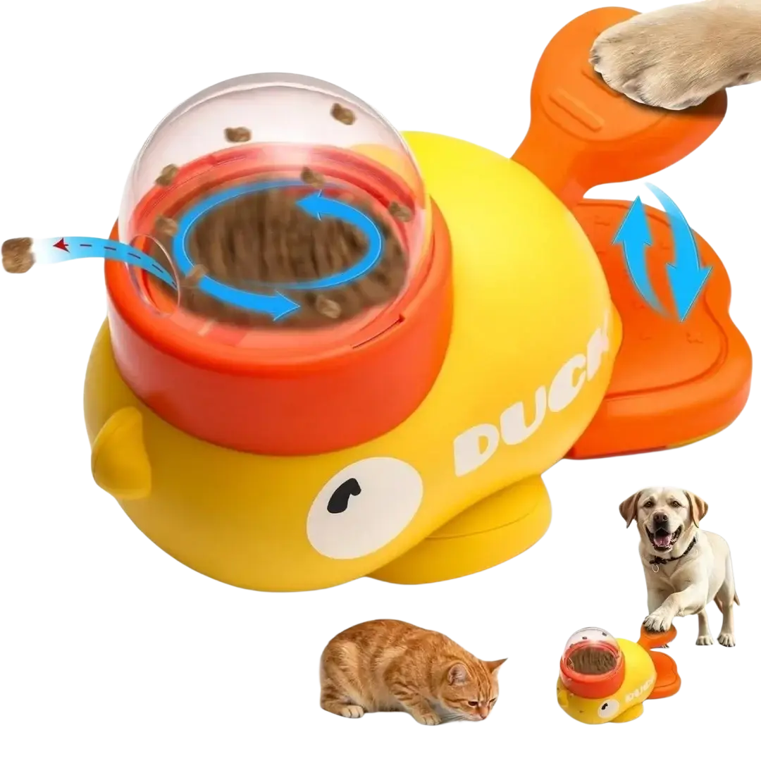 Yellow and orange duck-shaped dog food puzzle feeder with clear dome top for slow automatic kibble dispensing