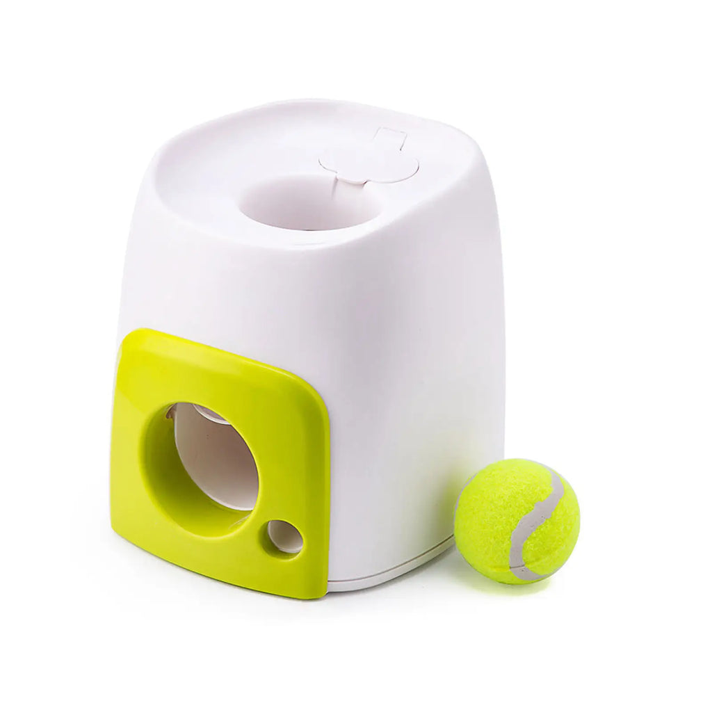 White and lime green plastic dog food reward machine interactive ball launcher with circular opening and side compartment