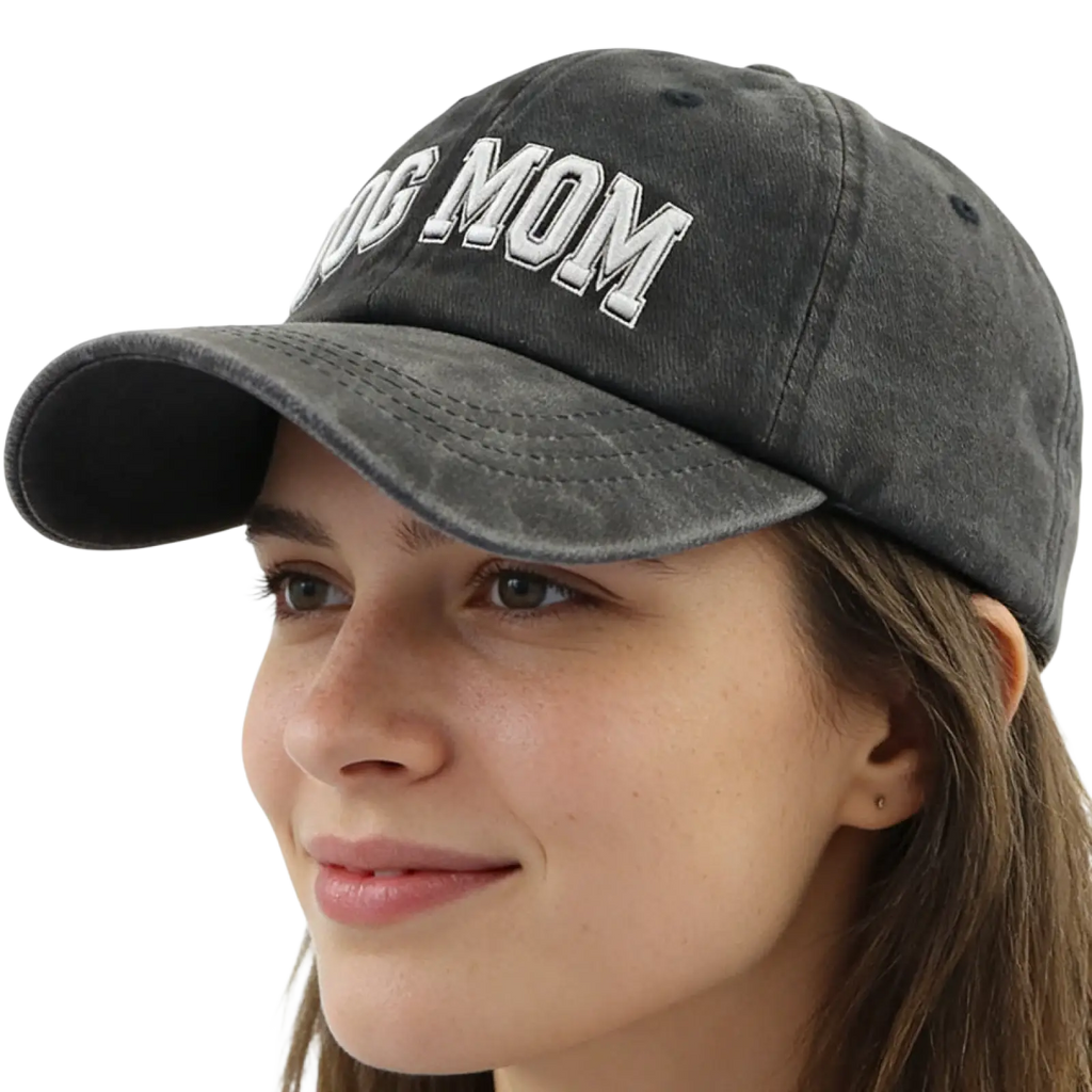 A dark gray distressed cotton baseball cap with dog mom embroidered in white and adjustable strap