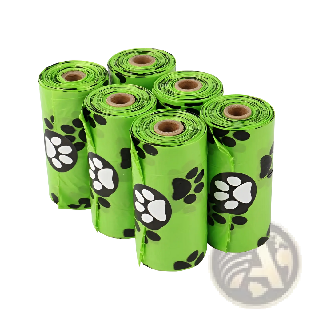 Bright green plastic dog poop bags with black and white paw prints featuring dispenser and refill rolls