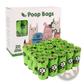 Bright green dog poop bags with black and white paw prints in a box featuring cartoon dogs and a dispenser