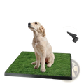 Black rectangular dog potty training artificial grass mat tray with green grass surface and textured underside shown