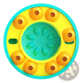 Bright yellow and teal circular dog puzzle feeder slow feed interactive toy with orange suction cups around the edge