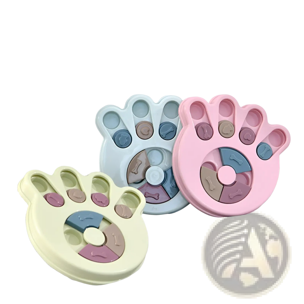 Pastel-colored plastic paw-shaped dog puzzle toy with segmented compartments and bone motifs for slow feeder training