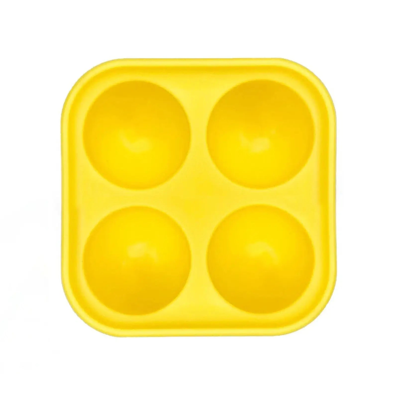 Bright yellow silicone ice cube tray with four round compartments in dog silicone slow feeder ball and tray toy set