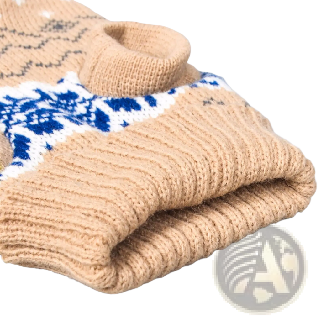 Beige knitted dog sweater featuring a blue and white nordic-inspired snowflake pattern for winter pet apparel