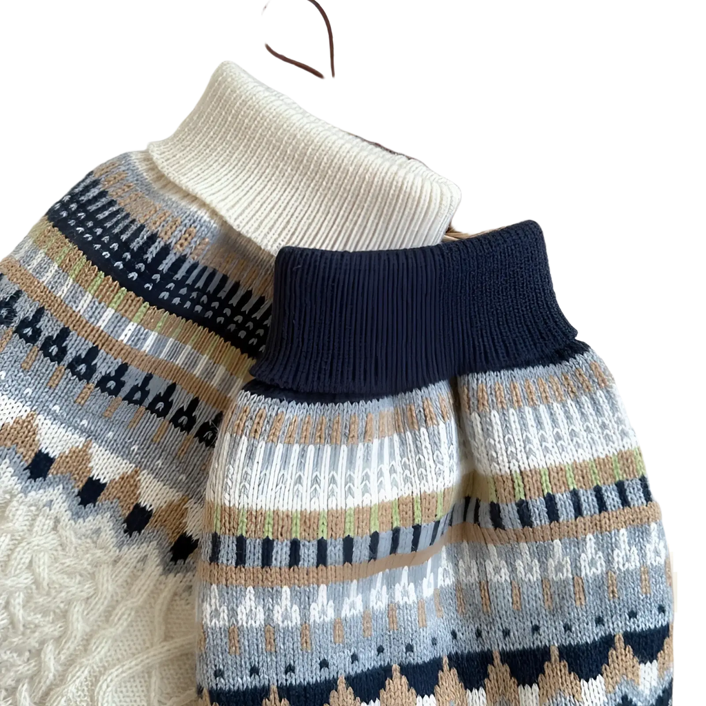 A cozy dog sweater in soft knit with high collar and geometric patterns in navy blue beige gray and white