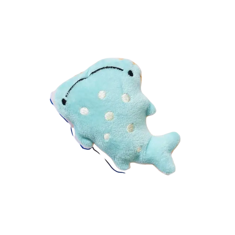A soft light blue plush whale with white polka dots and embroidered eyes dog toys pet interactive plush toy