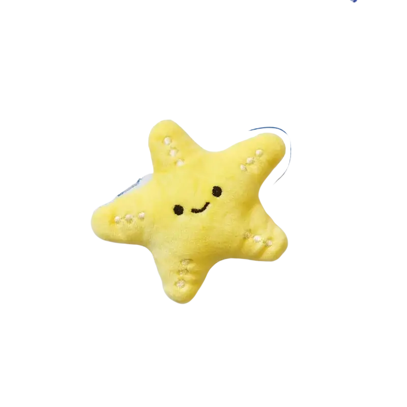 A soft yellow plush starfish dog toy with embroidered eyes and beads designed as interactive pet plush sea animal toy