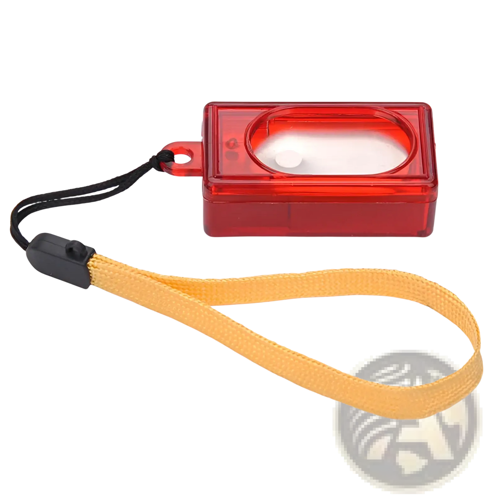 Red translucent plastic camera lens cover with yellow fabric strap and black clasp for dog training clicker square pet trainer tool