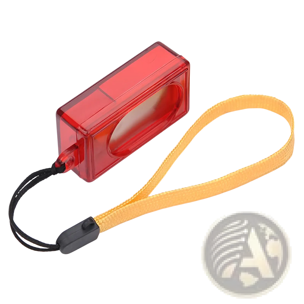 Red translucent plastic handheld dog training clicker with yellow wrist strap and black clasp for pet training