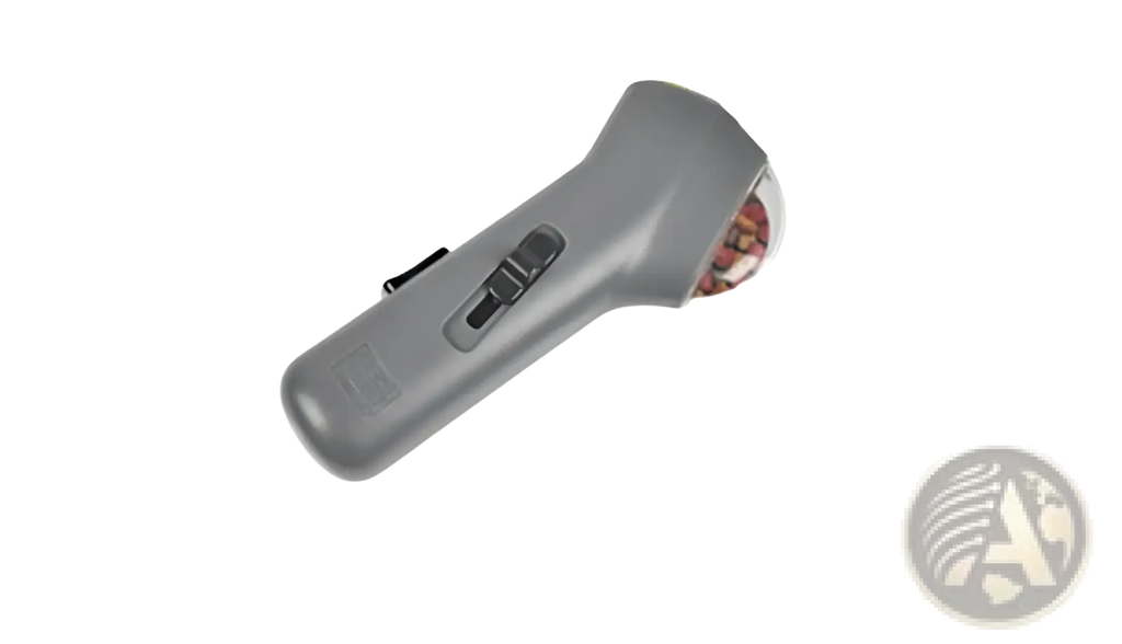 Gray plastic dog training snack launcher with rounded handle and transparent dome showing colorful internal components