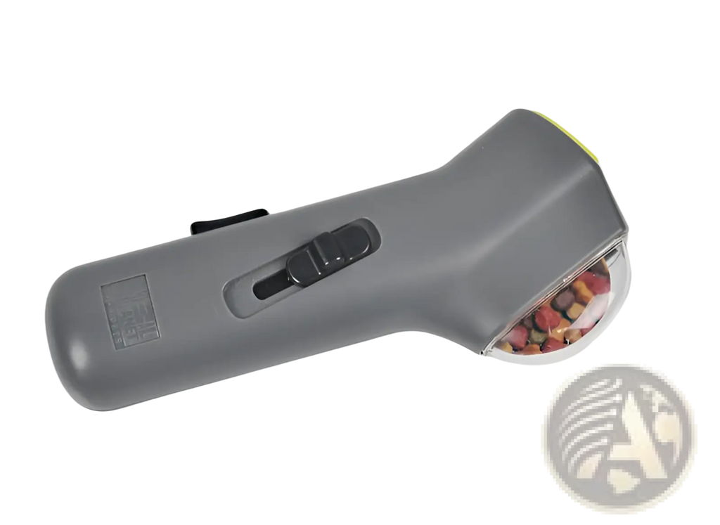 Gray handheld pet hair remover with transparent chamber filled with colorful fur and black trigger for dog training snack launcher