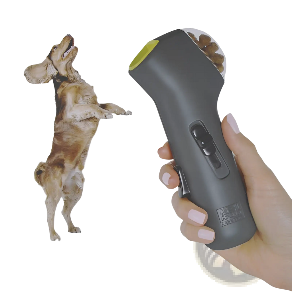 Gray and lime green handheld dog training snack launcher with textured grip and visible button controls for pet treats