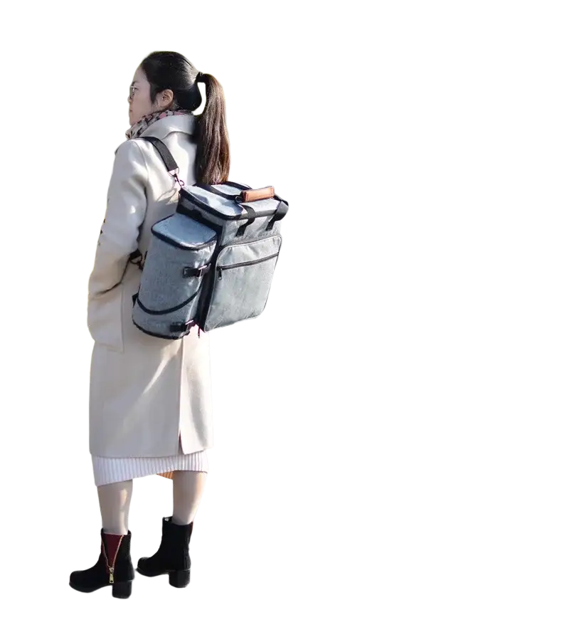 Gray fabric dog travel bag organizer backpack with black trim and brown leather handle designed for food carriers and airline use