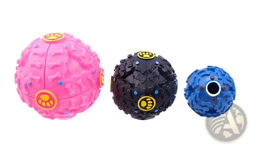 Three colorful dog treat dispenser squeaky rubber training balls in pink black and blue with paw print decals