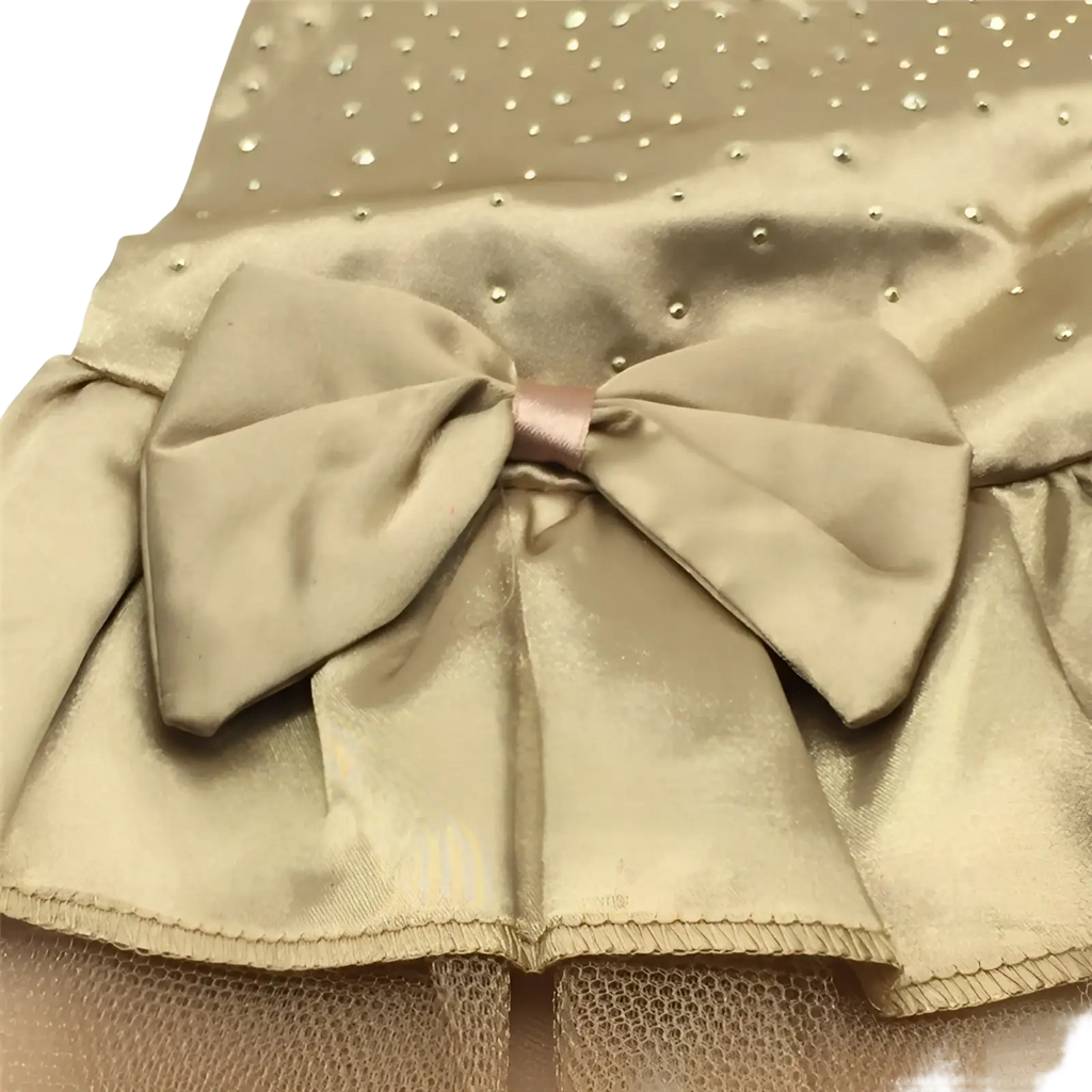 A shimmering gold satin bow with rhinestones on a dog wedding dress rhinestone tulle pet apparel
