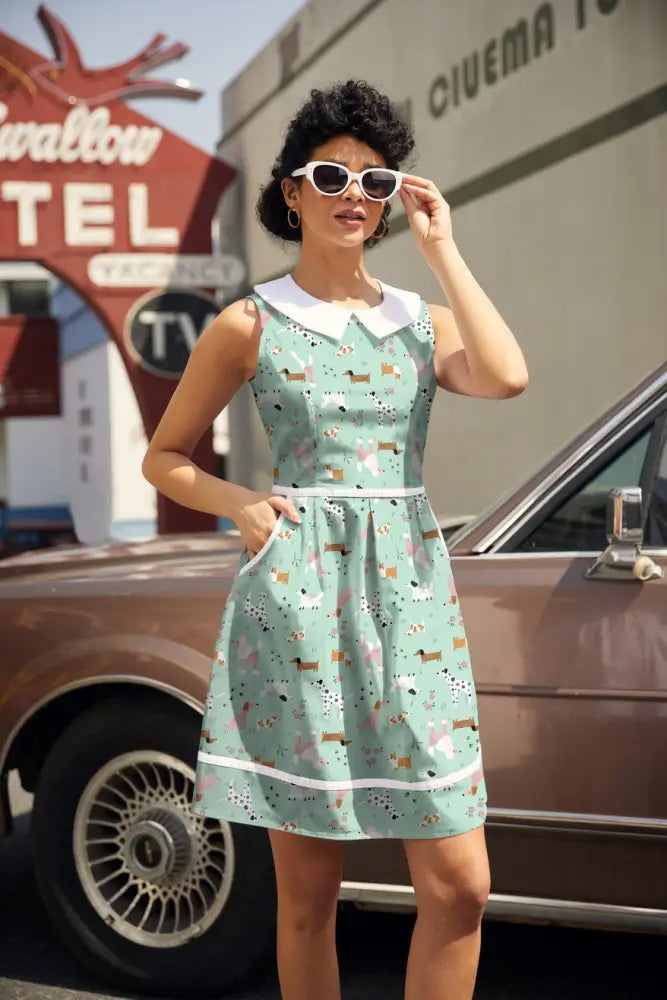 Mint green sleeveless retro a-line cotton dress with white collar and dachshund print featuring pockets