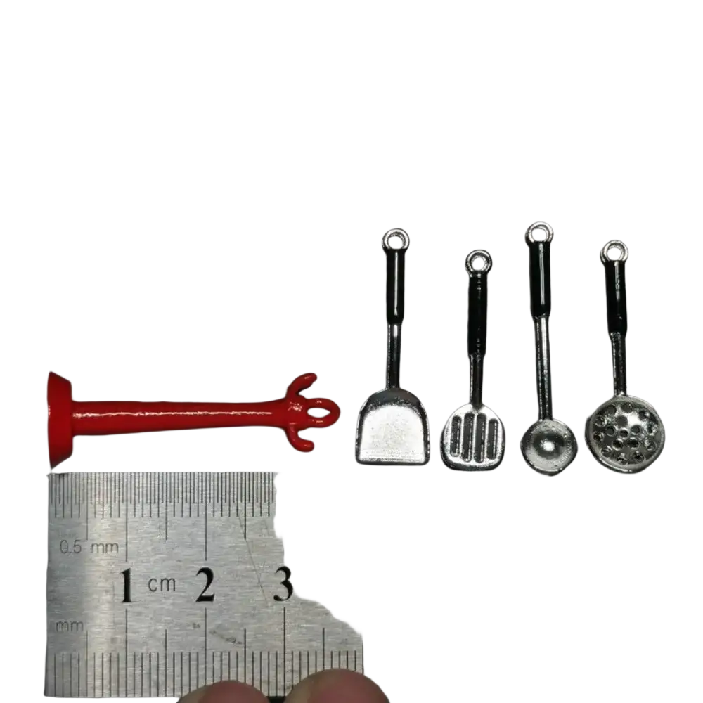 Red plastic fork-like toy kitchen utensil from dollhouse miniature kitchen utensils set for pretend play