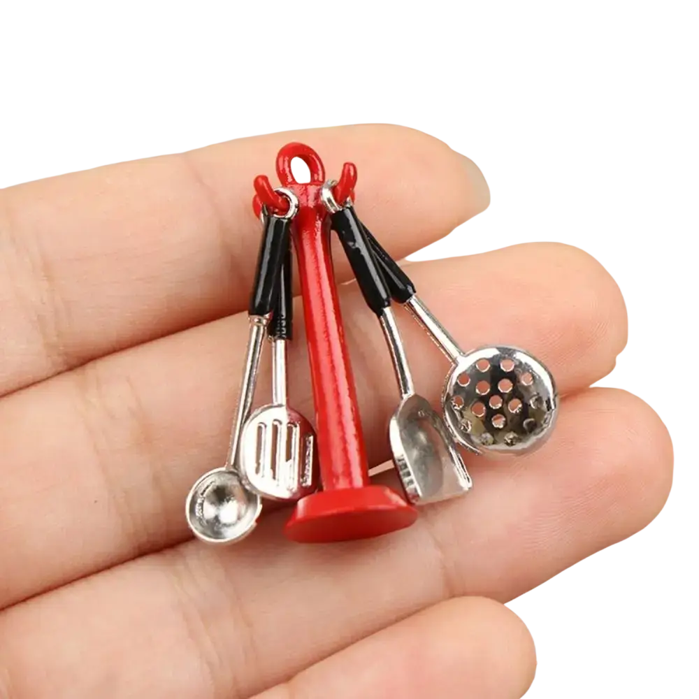 Dollhouse miniature kitchen utensils set with red and silver metal utensils featuring black handles as decorative charms