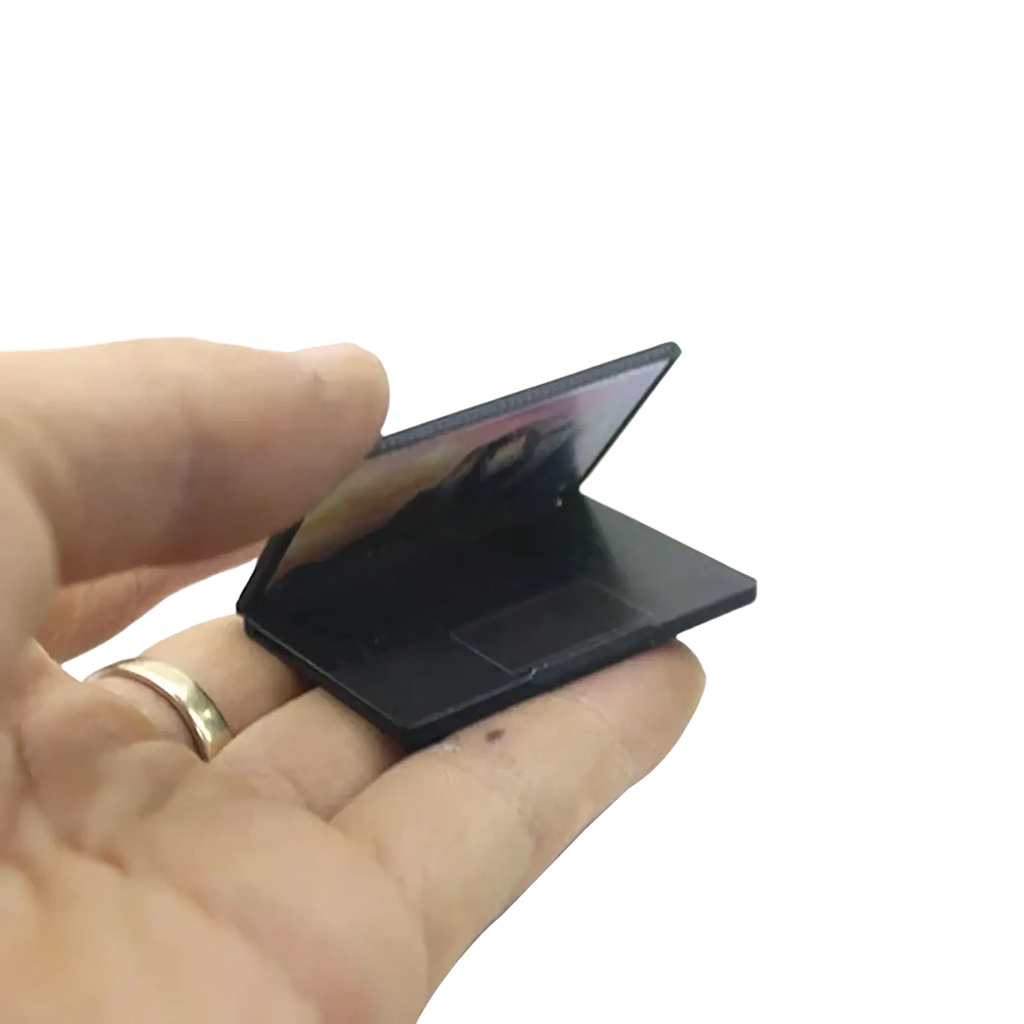 Black miniature laptop model with glossy finish and foldable screen for dollhouse 1/12 scale display