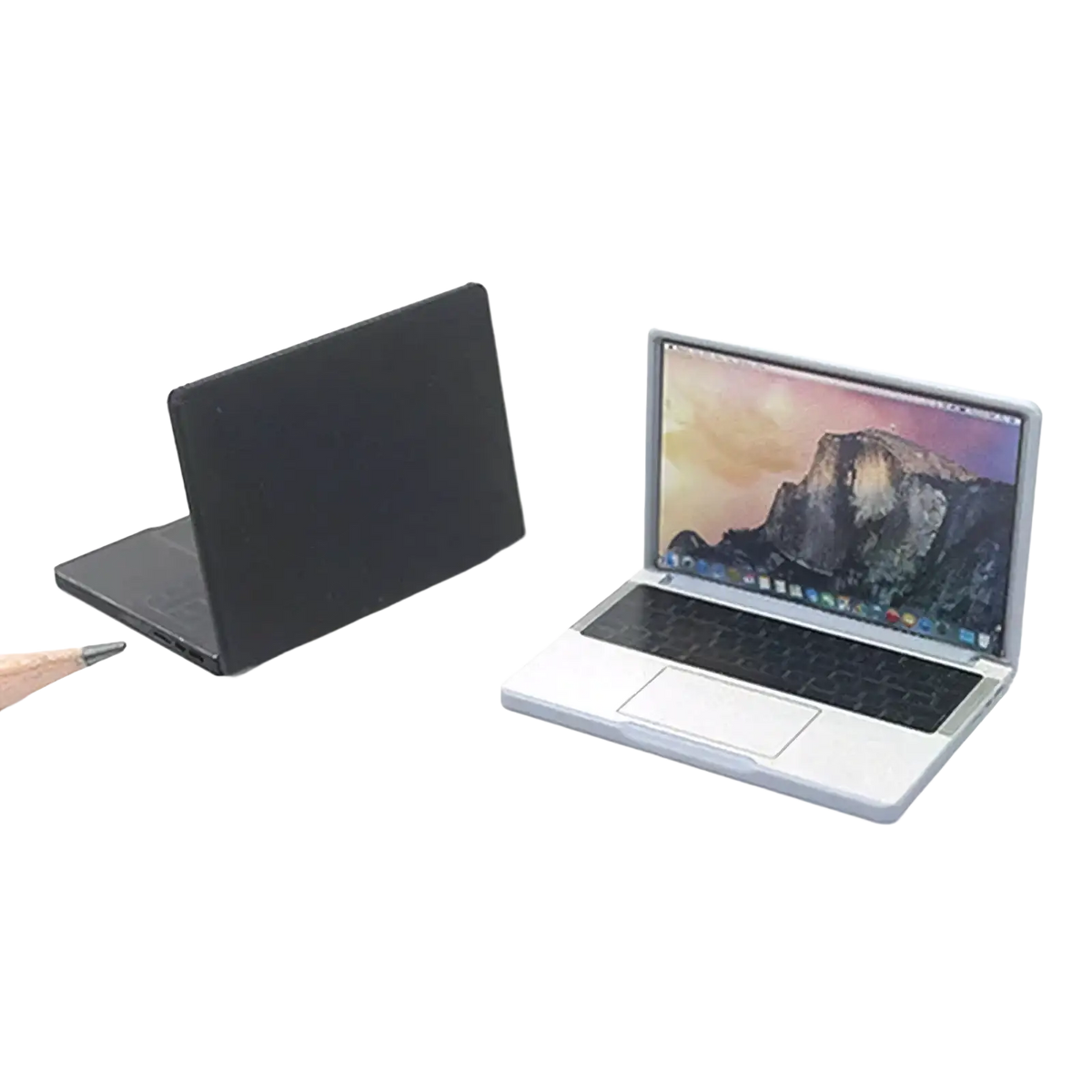 Silver dollhouse miniature laptop 1/12 scale with black keyboard and trackpad showing mountain landscape wallpaper