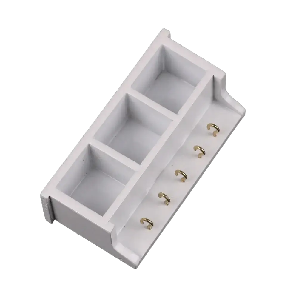 Dollhouse miniature white wall rack with three rectangular compartments and five gold toned side hooks