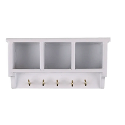 White wall-mounted dollhouse miniature organizer with three compartments and five gold-colored hooks below
