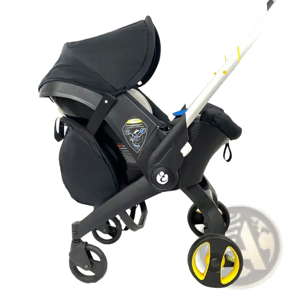 Black and yellow doona stroller with convertible car seat attachment shown with a storage bag travel knapsack